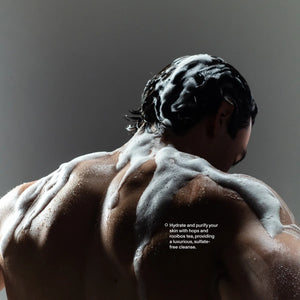 Man's back lathered with Blind Barber Lemongrass Tea Body Wash in the shower, sulfate-free cleanse, The Simple Man