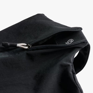 Close-up of a black jacket with a zipper on a white background