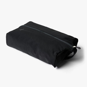 Black toiletry bag on a white background