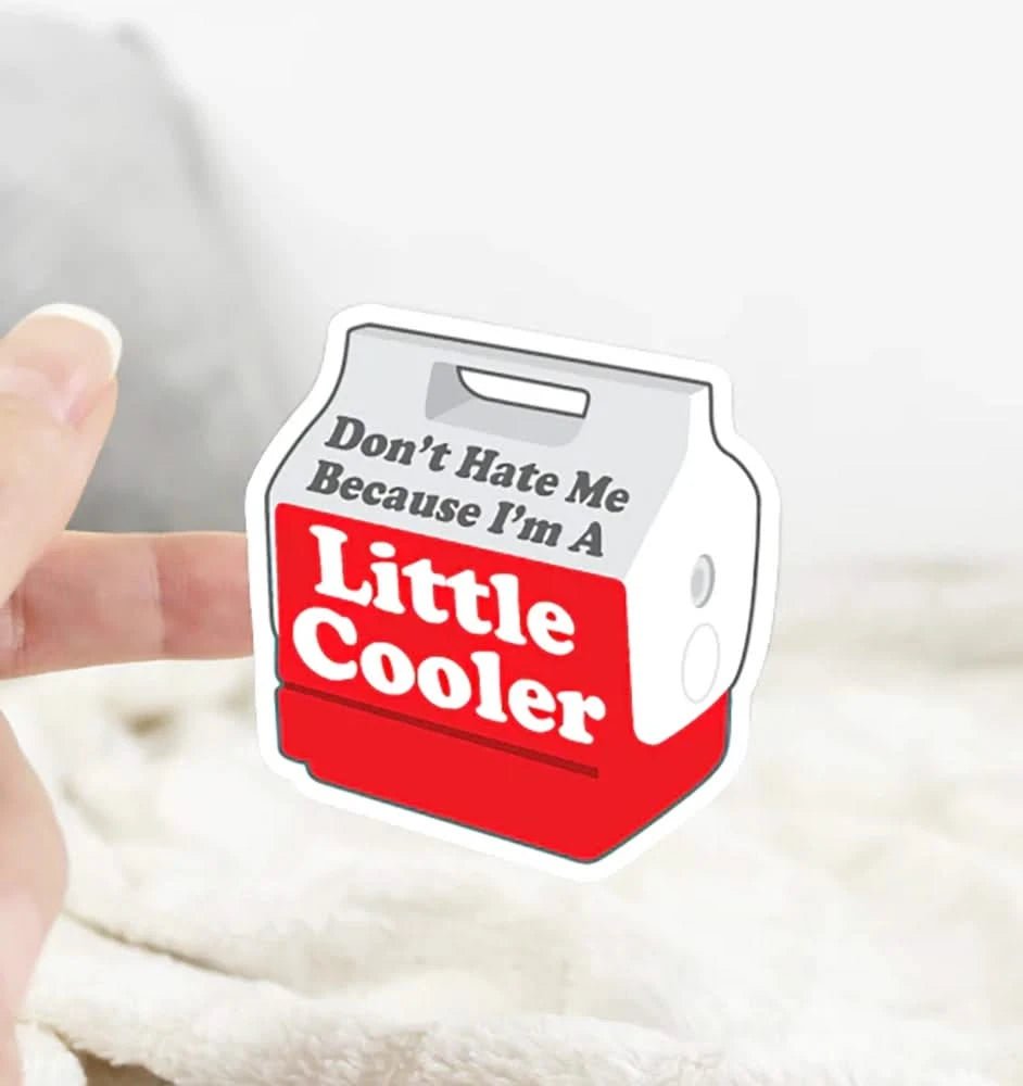 Don’t Hate Me Because I’m a Little Cooler sticker held in hand – durable vinyl decal for men’s gear