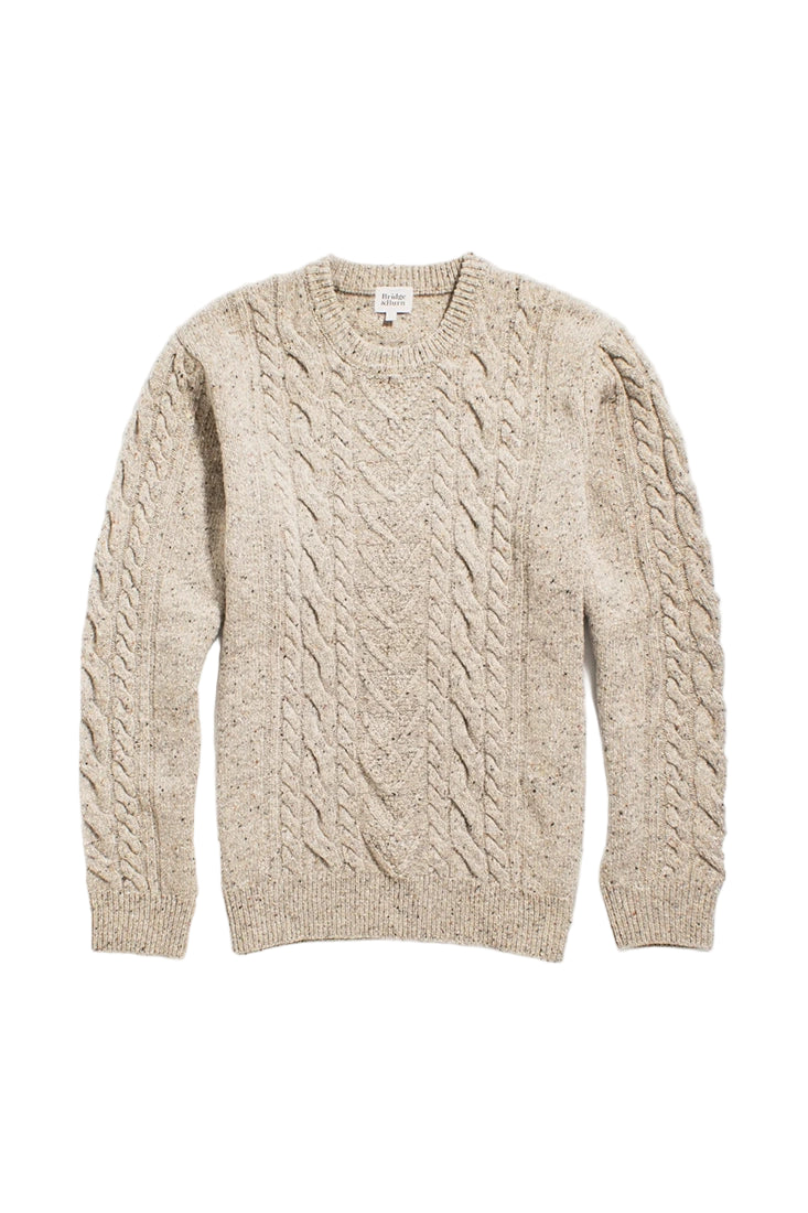 Flat lay of The Ludlow Sweater by Bridge & Burn showing detailed cable-knit pattern and ribbed cuffs in oatmeal merino blend