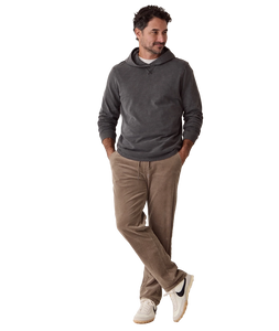 Man wearing Luxe Slub Hoodie in Asphalt full length, styled with corduroy pants and sneakers - The Simple Man