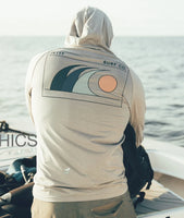 Mahi UV Tech Hoodie Grey lifestyle on boat – UPF 50+ performance hoodie with Jetty Surf Co wave graphic – The Simple Man
