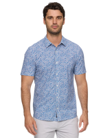 Man wearing Flag and Anthem MadeFlex Journey Stretch Shirt in blue floral print – wrinkle-free 4-way stretch men's button-down tailored athletic fit