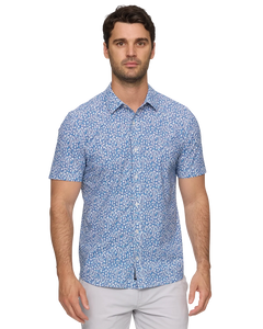 Man wearing Flag and Anthem MadeFlex Journey Stretch Shirt in blue floral print – wrinkle-free 4-way stretch men's button-down tailored athletic fit
