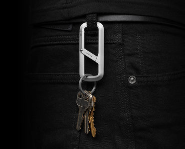 Silver Madison carabiner clipped to belt loop with keys – durable EDC clip from The James Brand at The Simple Man