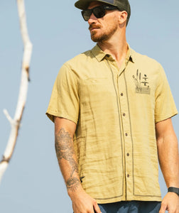 Marshall Embroidered Linen Shirt Olive lifestyle – men's short sleeve button-down with duck marsh graphic – The Simple Man