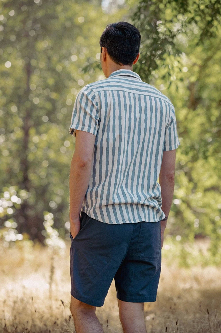 Bridge & Burn Marten Shirt Beach Stripe – back view on model outdoors wearing men's relaxed fit cotton vertical stripe button down shirt