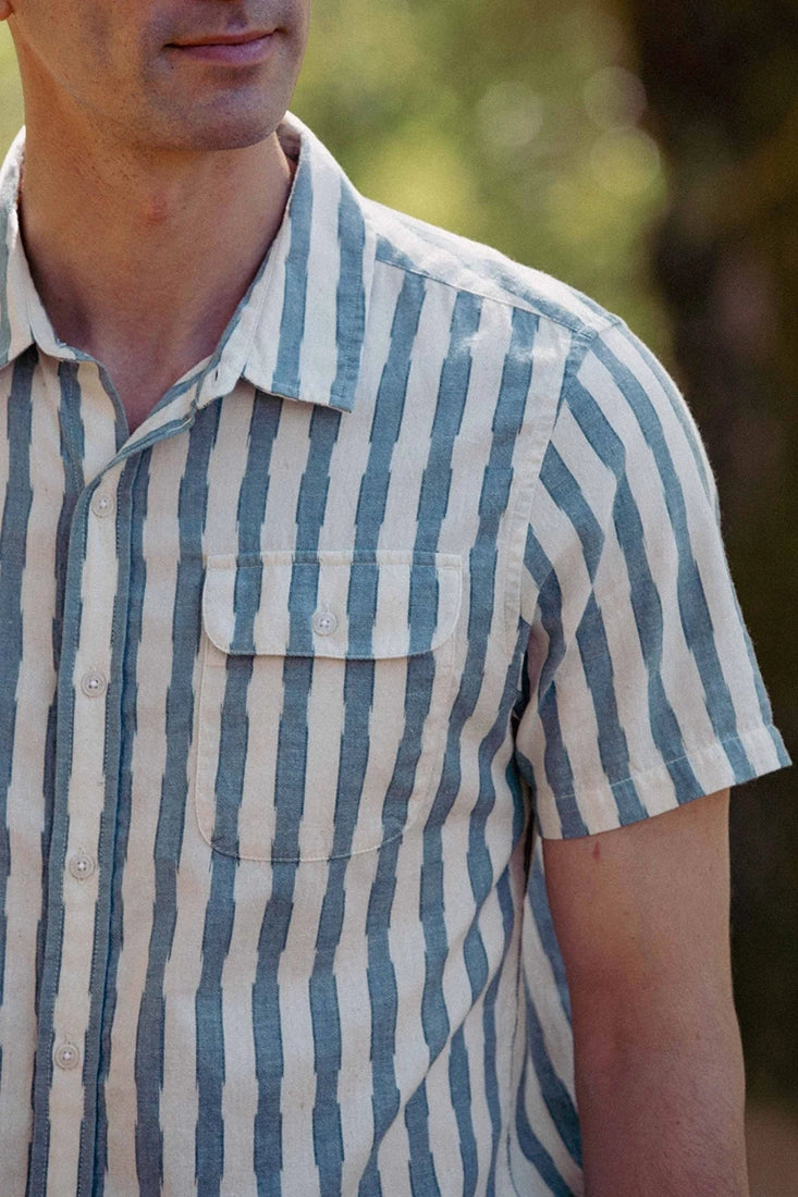 Bridge & Burn Marten Shirt Beach Stripe – close-up of chest pocket and collar on men's slate blue and cream cotton stripe short sleeve shirt