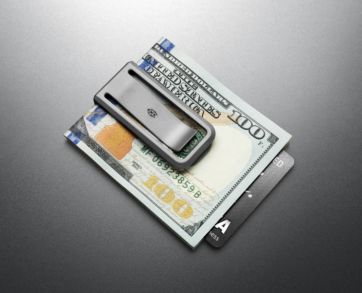 The Martindale titanium money clip securing folded bills and credit cards – front pocket carry gear