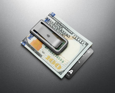 The Martindale titanium money clip securing folded bills and credit cards – front pocket carry gear