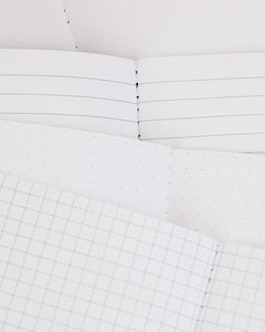 Inside pages of Medicine Pocket Notebook showing lined, dot grid, and graph paper styles