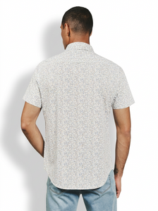 Back view of Mercer Natural short sleeve button-up shirt on man – all-over micro floral print stretch knit men's shirt