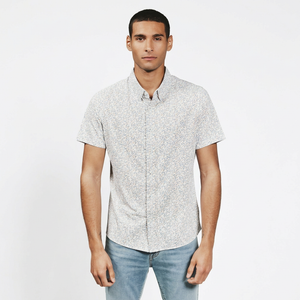 Mercer Natural floral short sleeve button-down shirt on man with jeans – 4-way stretch structured knit men's casual shirt
