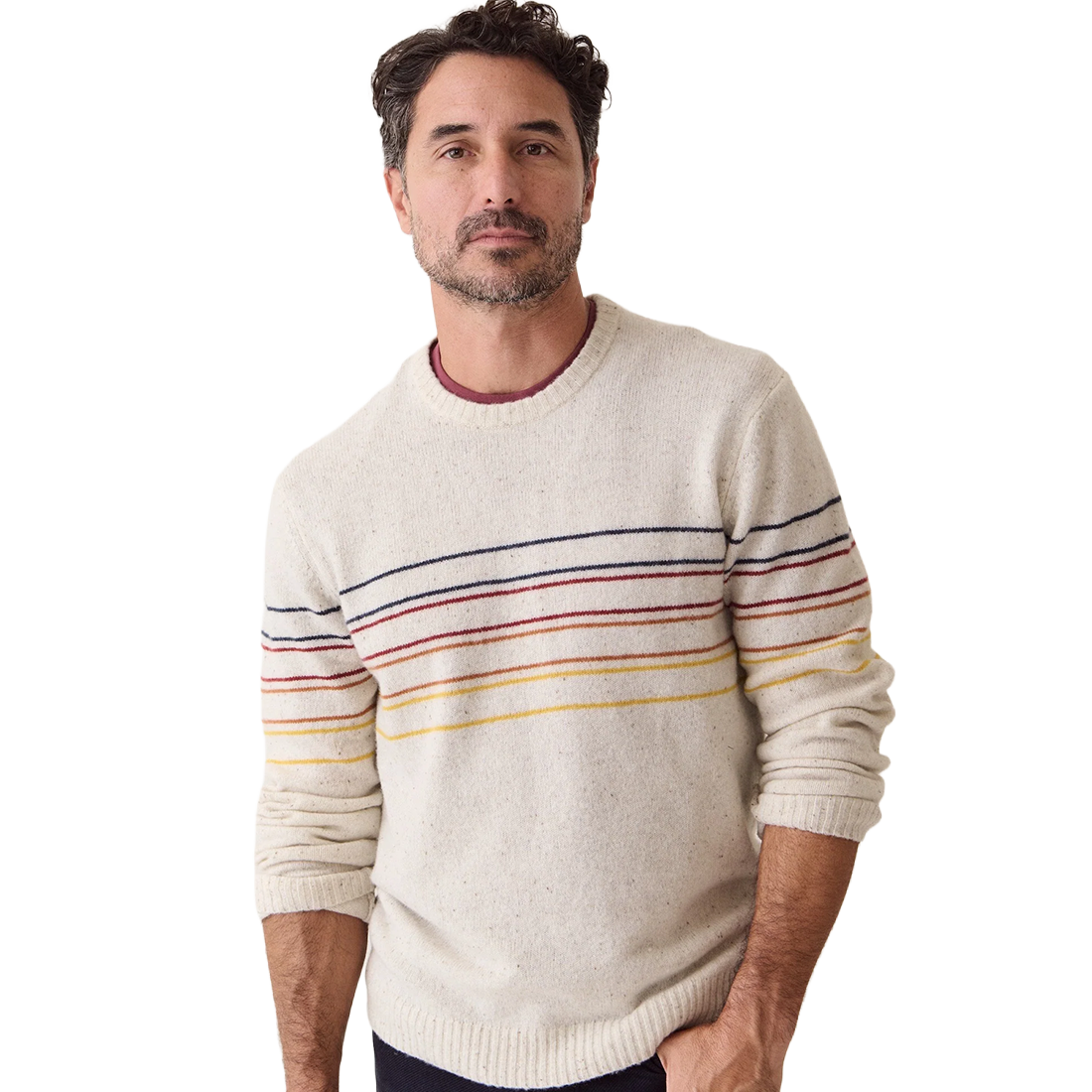 Man wearing the cream Snowhill Sunset Stripe merino crewneck over a maroon tee, front view