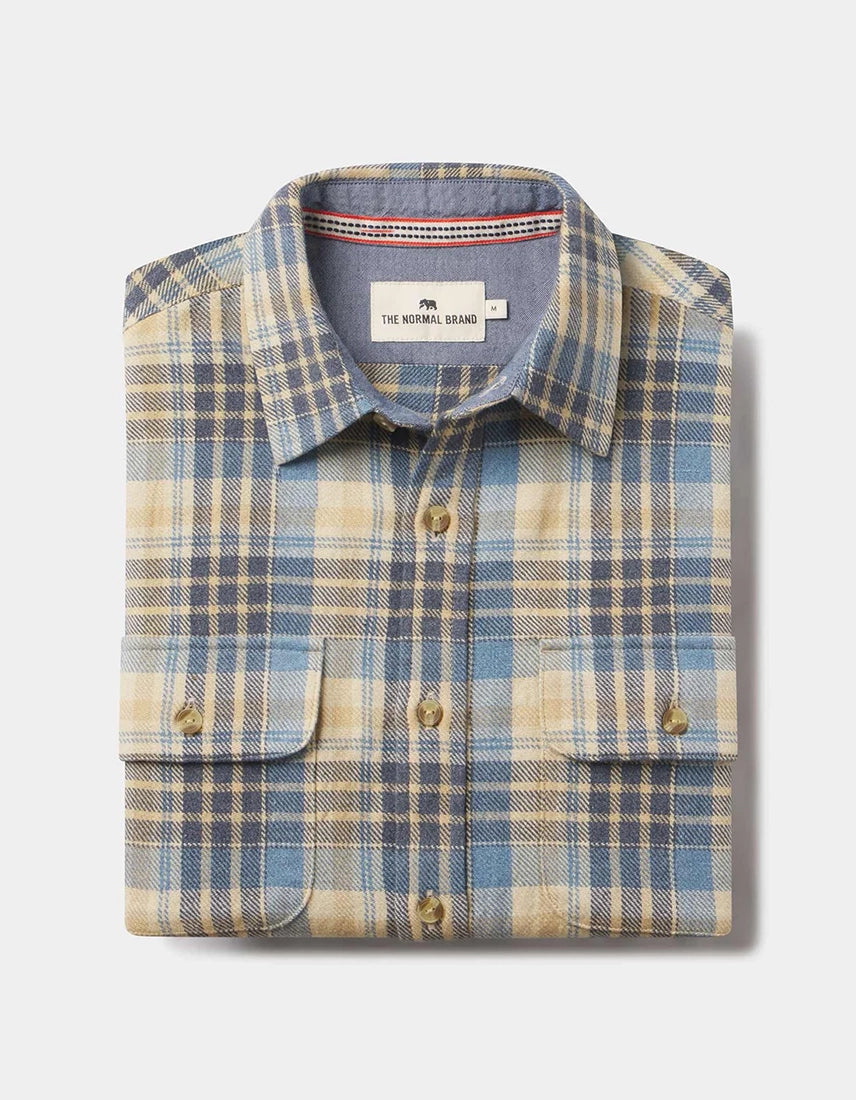 Folded Mountain Overshirt in vintage blue plaid with dual flap pockets and branded buttons—100% cotton heavyweight twill shirt available at The Simple Man.