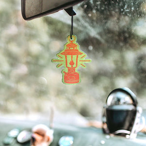 Good and Well Supply Co. Air freshener in Olympic scent, shown hanging in a car