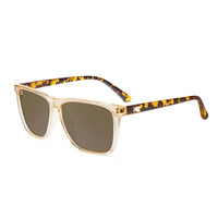 Knockaround Fast Lanes On The Rocks sunglasses front angle view — translucent amber frame matte tortoise arms polarized amber lenses