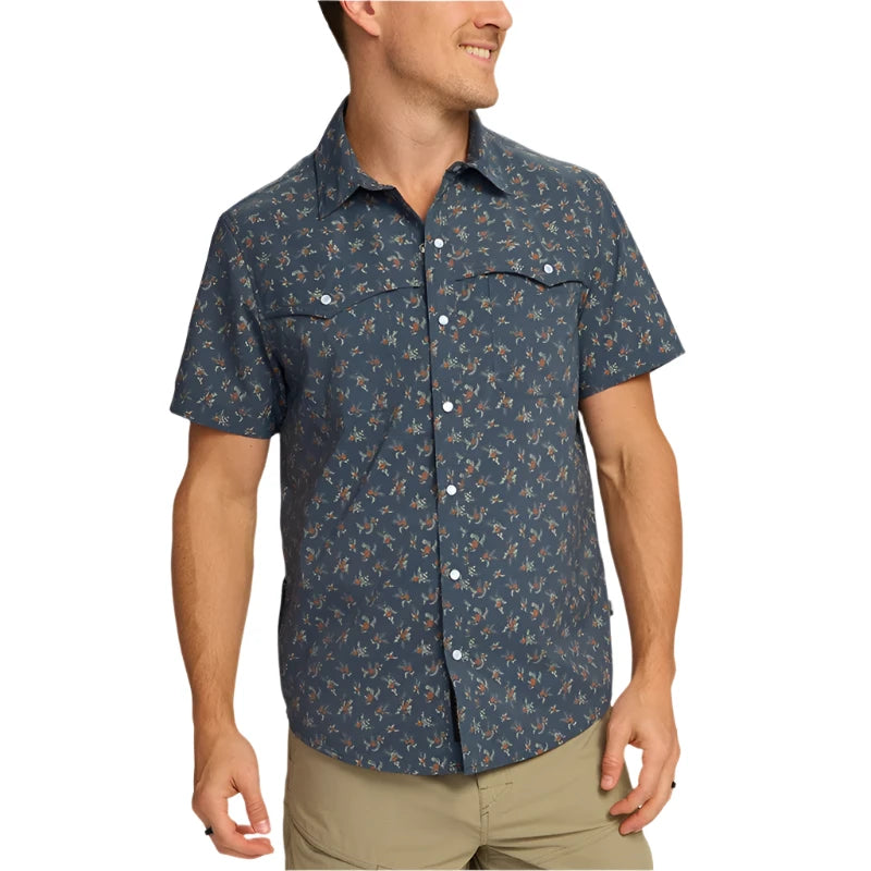 Model wearing Howler Brothr's Open Country Tech shirt in the Rancher floral - dark Slate option, front view