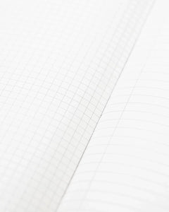 Inside pages of Ornithology Birds Hardcover Notebook showing grid and lined paper – eco-friendly journal from The Simple Man