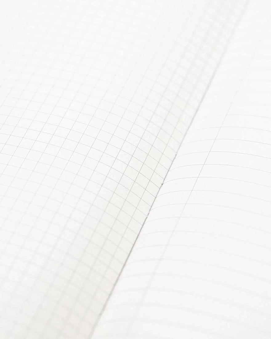 Inside pages of Ornithology Birds Hardcover Notebook showing grid and lined paper – eco-friendly journal from The Simple Man