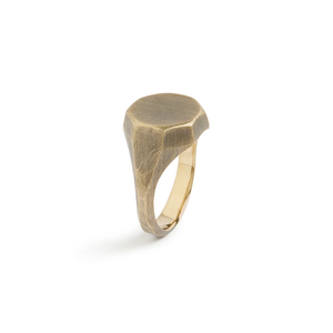 Side view of the brass Otto Signet Ring showing the octagonal face and faceted file-marked shank