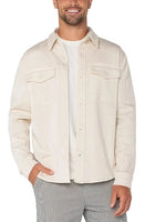 Model wearing Liverpool overshirt in parchment color, front view