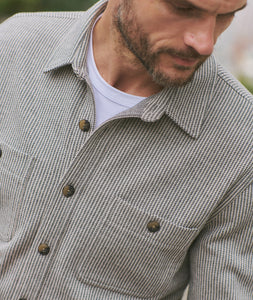 Close-up of Pacifica Stretch Twill Overshirt in grey railroad stripe pattern, featuring brass-tone buttons and textured stretch twill fabric – The Simple Man