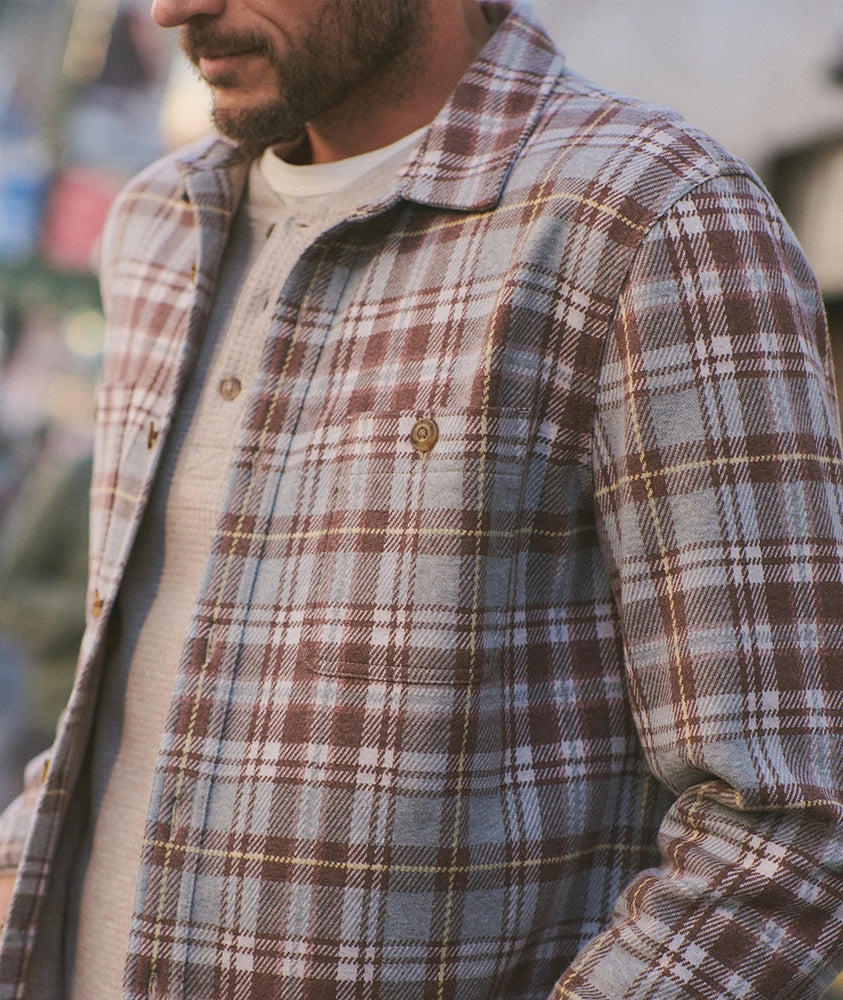 Close-up of Pacifica Stretch Twill Overshirt in warm plaid pattern, lightweight 215 GSM fabric, worn layered over henley shirt – The Simple Man