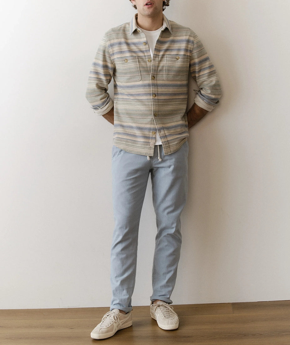 Men wearing Pacifica stretch twill overshirt in blue and green Baja stripe layered over a white t-shirt