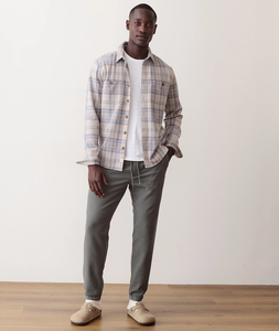 Man wearing Pacifica Stretch Twill Overshirt in Grey Plaid full length, styled with olive joggers and clogs - The Simple Man