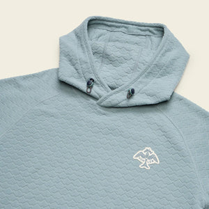 Detail of bungee drawcord hood and embroidered chest logo on blue fleece hoodie