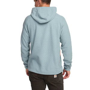 Back view of Palo Duro fleece hoodie in iron blue with hood up, shown on model