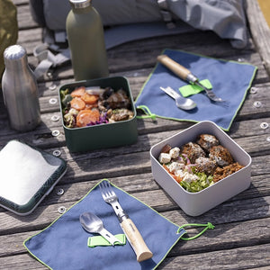 Lifestyle photo showing a picnic using Opinel Picnic + cutlery set, Individual pieces displayed
