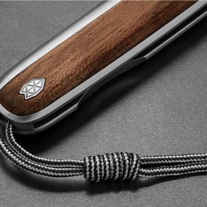 The James Brand Pike rosewood Damasteel knife lifestyle shot on surface