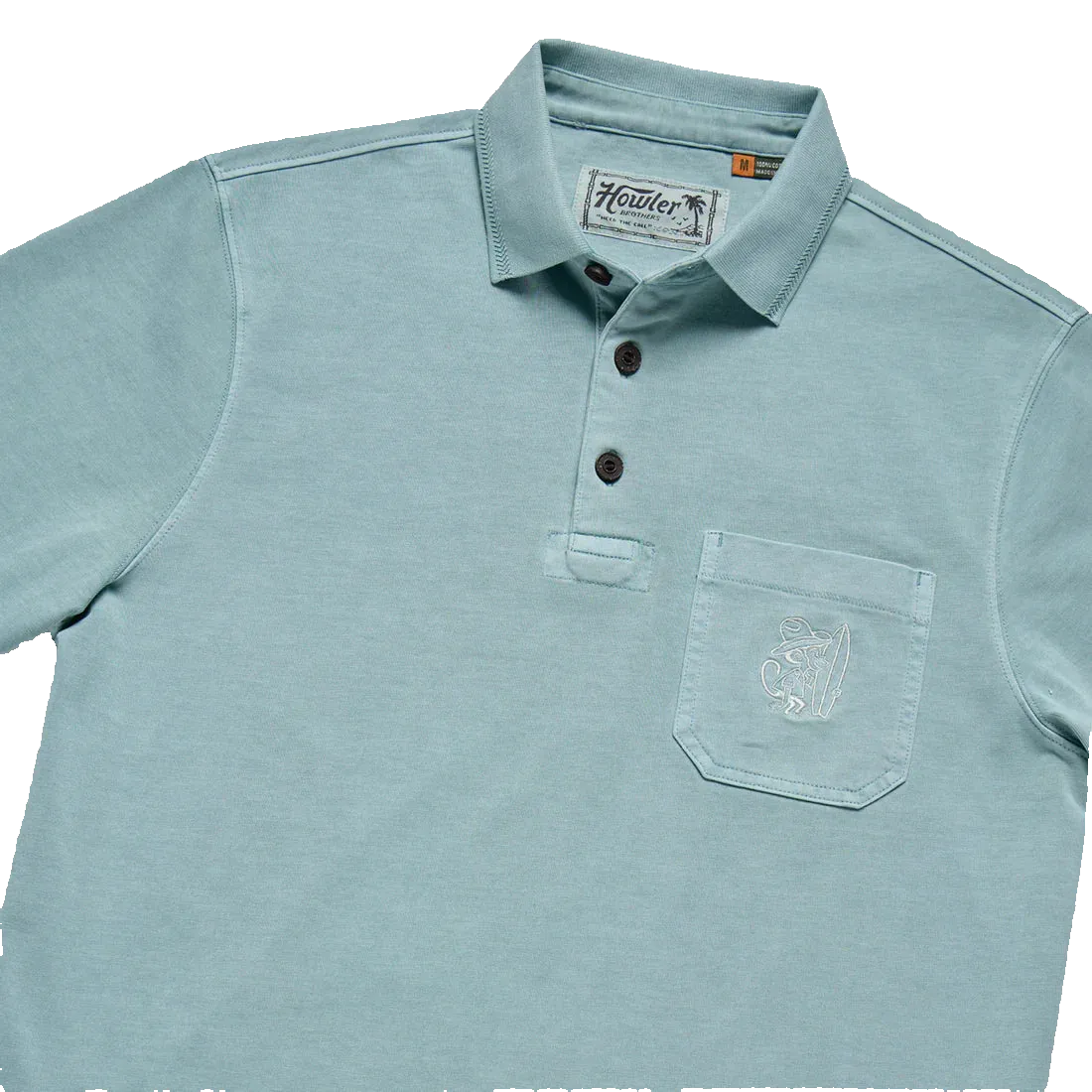 Howler Brothers Pilgrimage Polo detail – herringbone rib collar, coconut buttons, and El Monito chest pocket embroidery