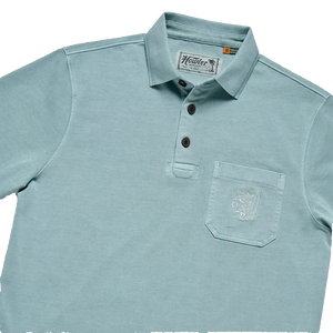 Howler Brothers Pilgrimage Polo detail – herringbone rib collar, coconut buttons, and El Monito chest pocket embroidery