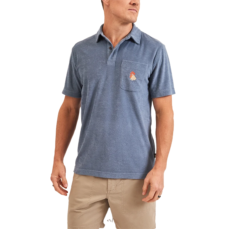 Model Wearing Howler Brothers Plusherman Terry Polo in Blue Mirage Color, flat lay view