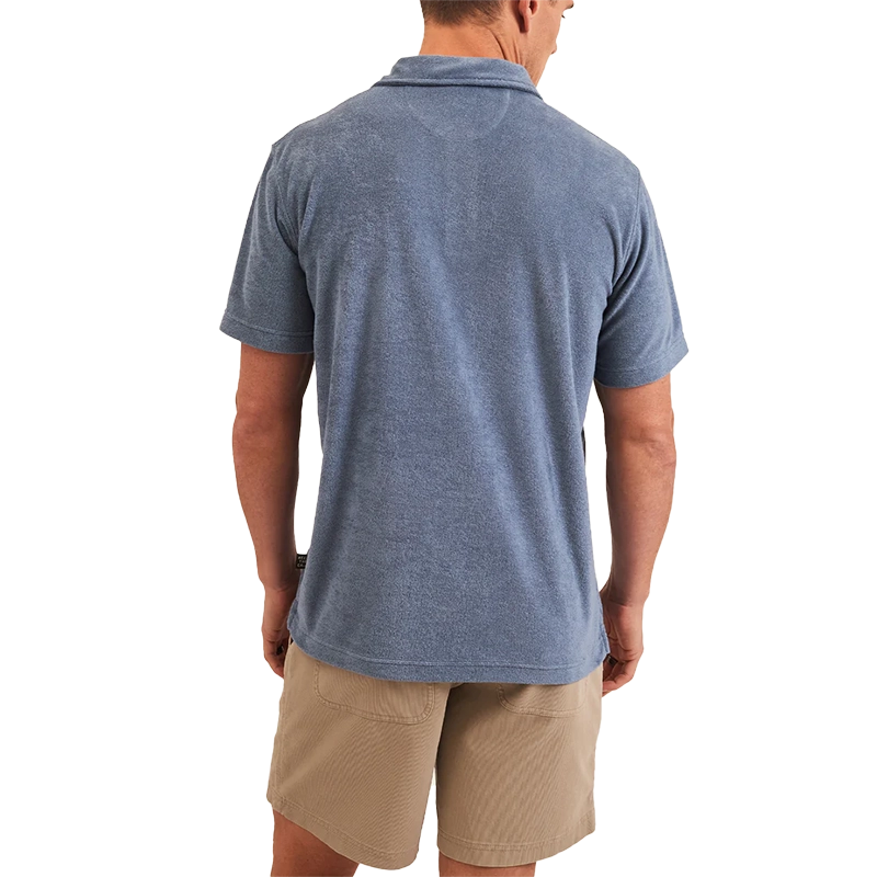 Model Wearing Howler Brothers Plusherman Terry Polo in Blue Mirage Color, rear view