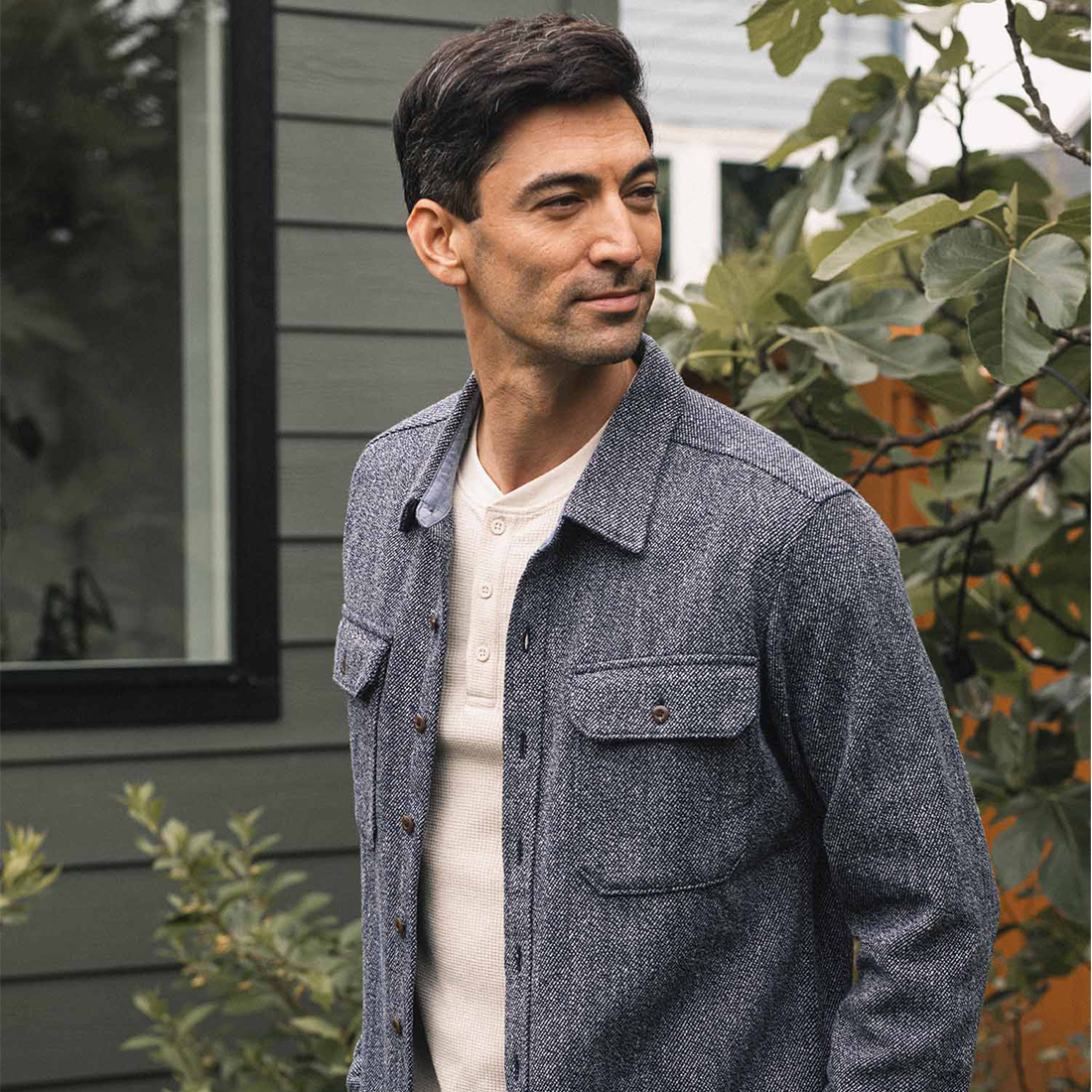 Man wearing the Pointer overshirt in Ocean Marl open over a cream waffle henley outdoors - The Simple Man