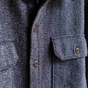 Close up of the marled twill texture and brown buttons on the Pointer overshirt in Ocean Marl - The Simple Man
