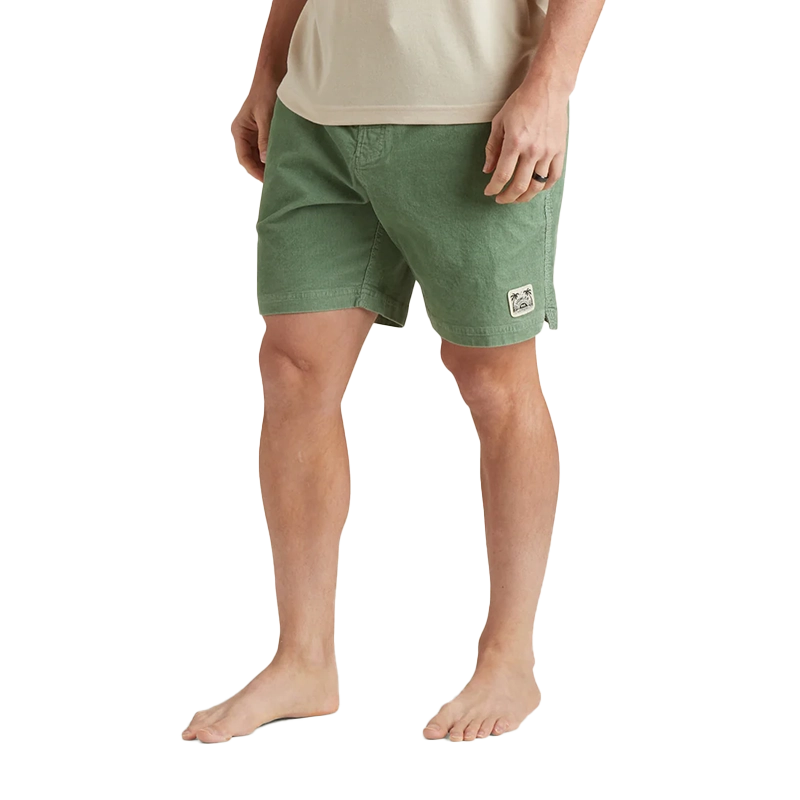 Model Wearing Howler Brothers Pressure drop cord shorts in Lichen Green, front view