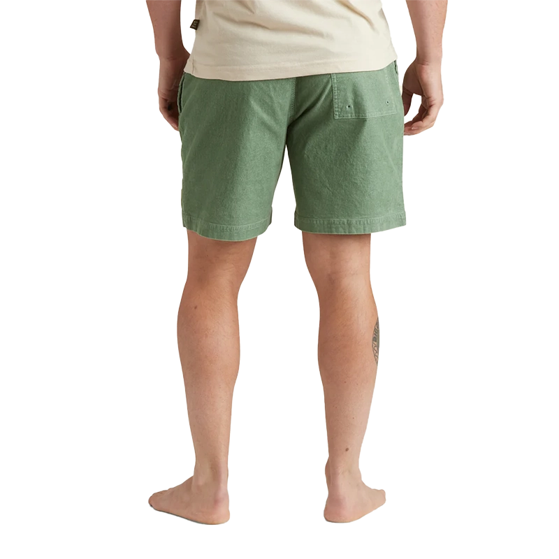 Model Wearing Howler Brothers Pressure drop cord shorts in Lichen Green, rear view