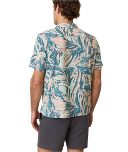 Model wearing Marine layer stretch selvage shirt in abstract palms print, casual shirt, rear  view
