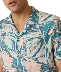 Model wearing Marine layer stretch selvage shirt in abstract palms print, casual shirt, close up detail view