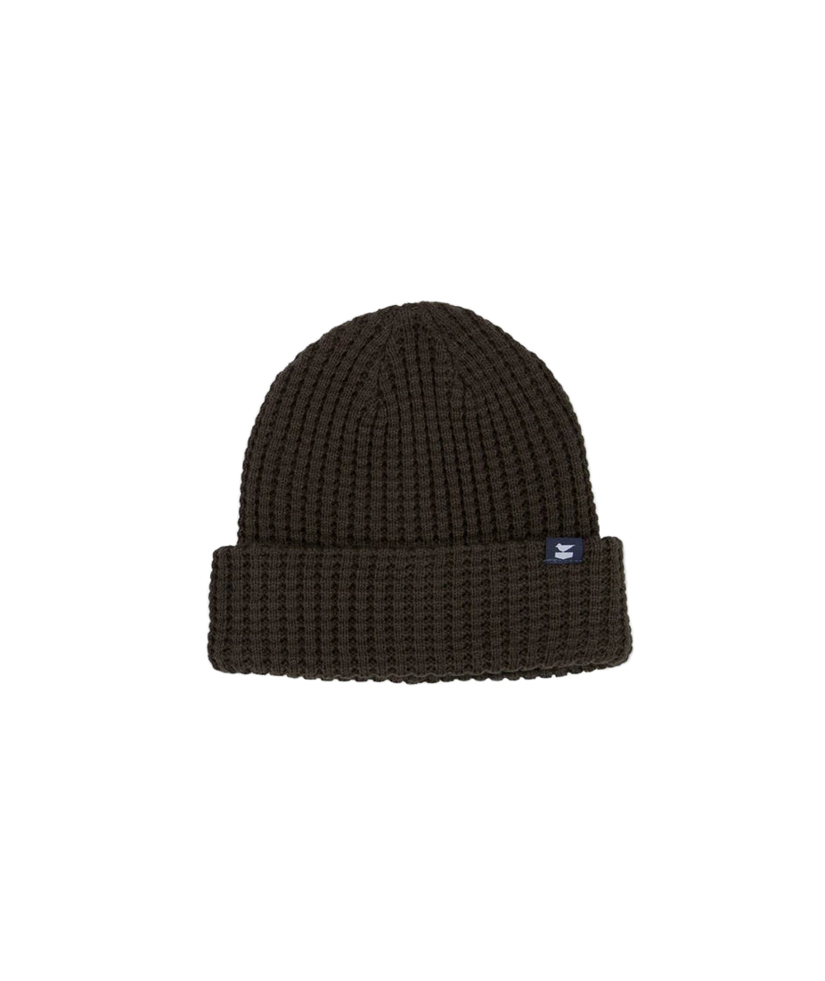 Close-up of chunky rib knit texture and woven label on Brown Prowl Beanie from The Simple Man