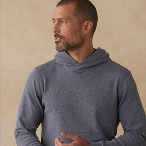 Man wearing Puremeso Essential Hoodie in Bluestone, close-up front view with hood down