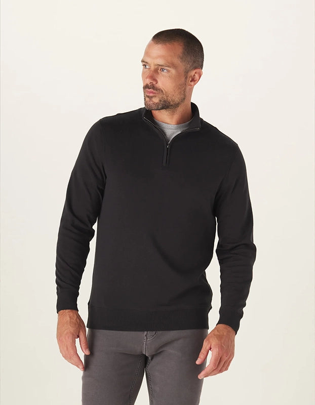 Model Wearing The Normal Brand Puremeso Weekend quarter Zip pullover in Black, Front view