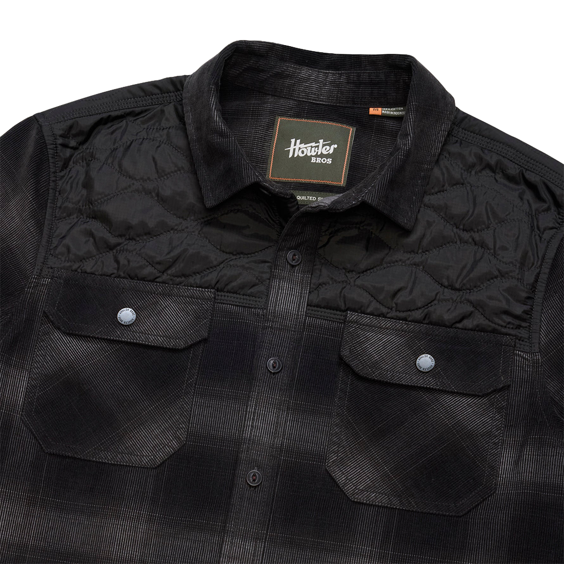 Collar and Howler Bros neck label detail on the Emmett Plaid Nightshade Quintana Quilted Shirt showing the quilted yoke, The Simple Man