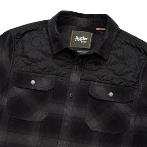 Collar and Howler Bros neck label detail on the Emmett Plaid Nightshade Quintana Quilted Shirt showing the quilted yoke, The Simple Man